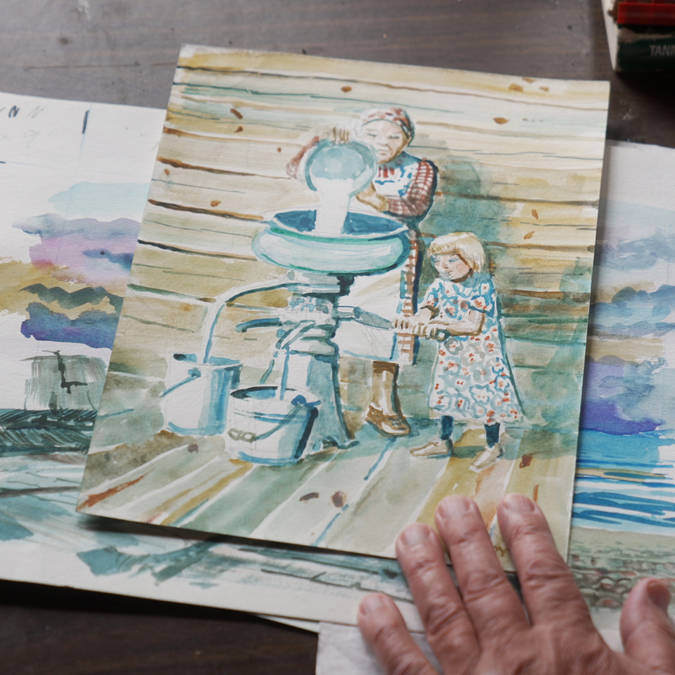 Gawboy shows artwork that highlights activities he’d seen growing up in Northern Minnesota. The image show shows a woman and a young girl pouring liquid into a container. 